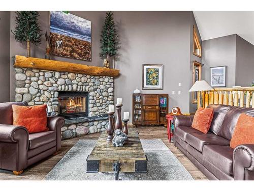 104 Silvertip Ridge, Canmore, AB - Indoor Photo Showing Living Room With Fireplace