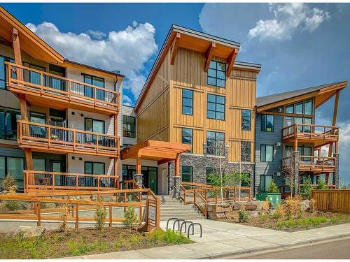311-106 Stewart Creek Rise, Canmore, AB - Outdoor With Facade