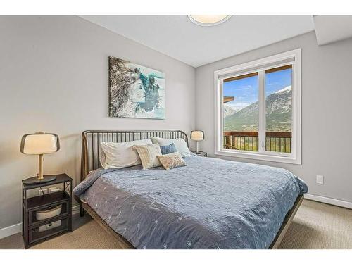 311-106 Stewart Creek Rise, Canmore, AB - Indoor Photo Showing Bedroom