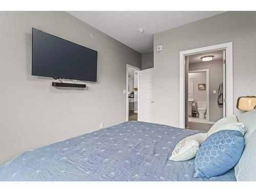 311-106 Stewart Creek Rise, Canmore, AB - Indoor Photo Showing Bedroom