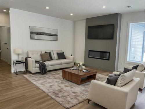 25, 660023-Range Road 224, Rural Athabasca County, AB - Indoor Photo Showing Living Room With Fireplace