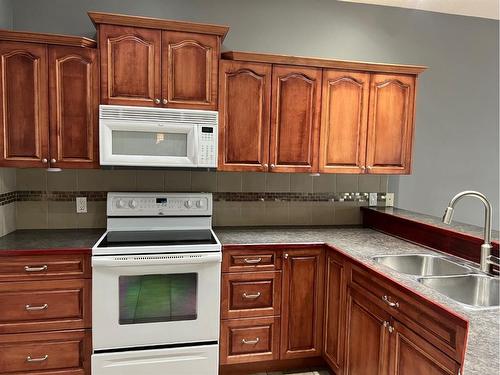 22 Cedar Heights, Whitecourt, AB - Indoor Photo Showing Kitchen With Double Sink