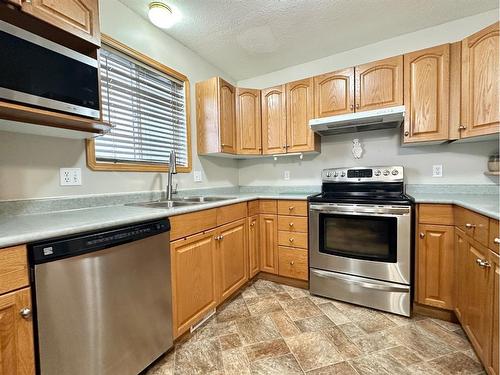 3623 & 3621 55 Ave, Whitecourt, AB - Indoor Photo Showing Kitchen With Double Sink