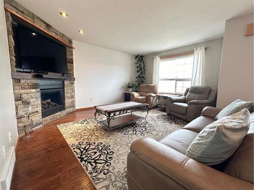 3623 & 3621 55 Ave, Whitecourt, AB - Indoor Photo Showing Living Room With Fireplace