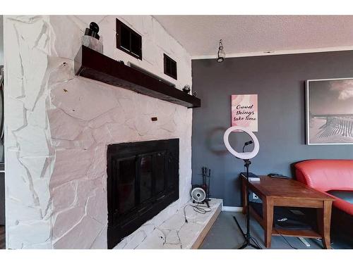 513 1A Avenue Sw, Slave Lake, AB - Indoor With Fireplace