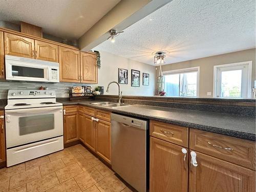24 Poplar Drive, Whitecourt, AB - Indoor Photo Showing Kitchen With Double Sink