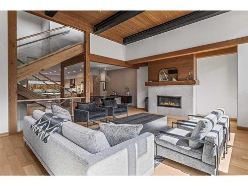 B-290 Three Sisters Drive, Canmore, AB - Indoor Photo Showing Living Room With Fireplace