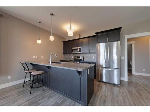 302-605 6 Avenue, Slave Lake, AB - Indoor Photo Showing Kitchen With Stainless Steel Kitchen With Upgraded Kitchen
