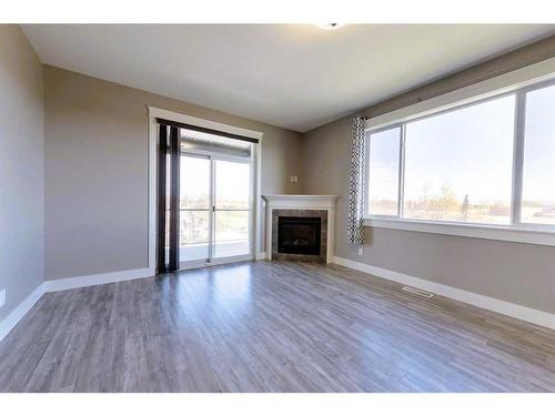 302-605 6 Avenue, Slave Lake, AB - Indoor Photo Showing Living Room With Fireplace