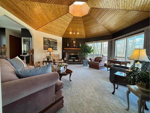 590029 Range Road 115, Rural Woodlands County, AB - Indoor Photo Showing Living Room With Fireplace