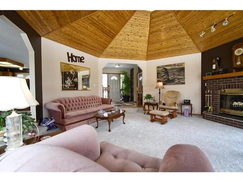 590029 Range Road 115, Rural Woodlands County, AB - Indoor Photo Showing Living Room With Fireplace