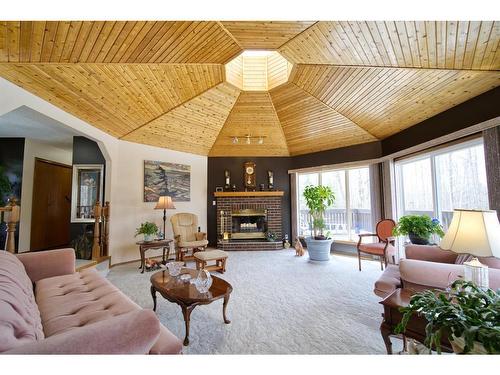 590029 Range Road 115, Rural Woodlands County, AB - Indoor Photo Showing Living Room With Fireplace