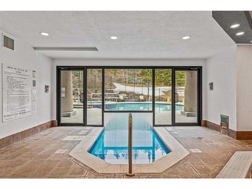 281-91B Three Sisters Drive, Canmore, AB - Indoor Photo Showing Other Room With In Ground Pool