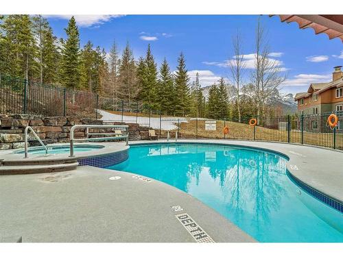 281-91B Three Sisters Drive, Canmore, AB - Outdoor With In Ground Pool With Backyard