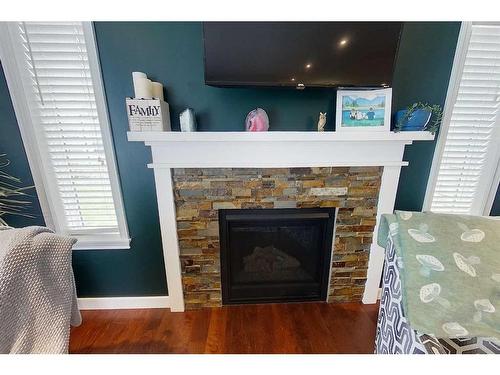 1613 41A Street, Edson, AB - Indoor Photo Showing Living Room With Fireplace