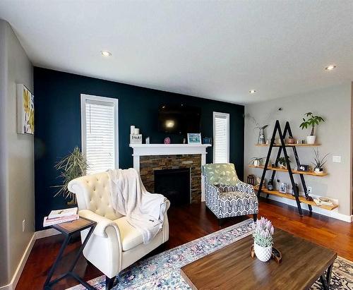 1613 41A Street, Edson, AB - Indoor Photo Showing Living Room With Fireplace