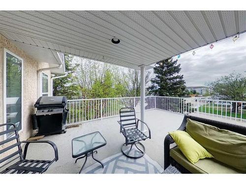 2-300 12 Street Sw, Slave Lake, AB - Indoor Photo Showing Living Room With Fireplace