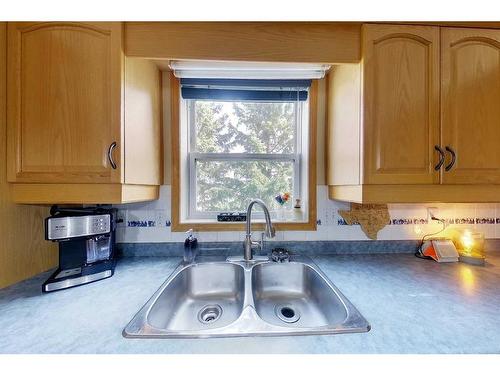 2-300 12 Street Sw, Slave Lake, AB - Indoor Photo Showing Living Room With Fireplace