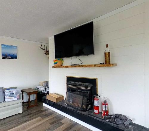 1002 50 Street, Edson, AB - Indoor Photo Showing Living Room With Fireplace