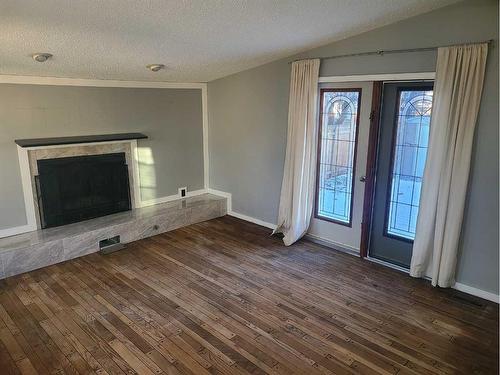 1414 53 Street, Edson, AB - Indoor Photo Showing Living Room With Fireplace