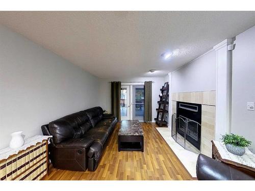 5435 15 Avenue, Edson, AB - Indoor Photo Showing Living Room With Fireplace