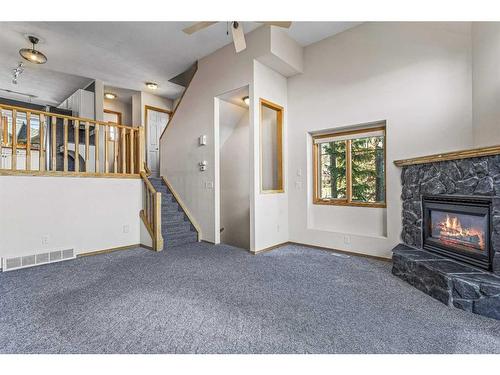 102-901 Benchlands Trail, Canmore, AB - Indoor With Fireplace
