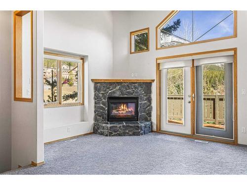 102-901 Benchlands Trail, Canmore, AB - Indoor Photo Showing Living Room With Fireplace