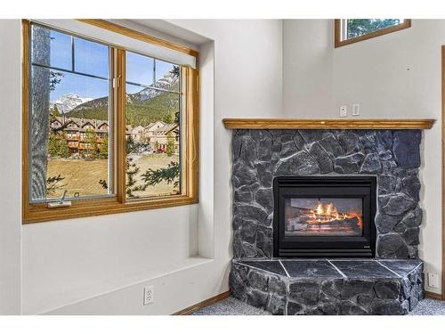 102-901 Benchlands Trail, Canmore, AB - Indoor Photo Showing Living Room With Fireplace