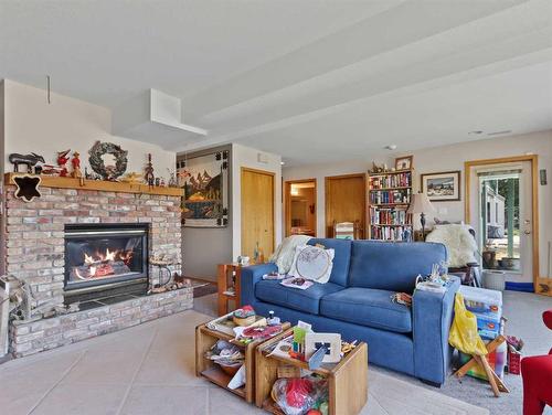 119 Benchlands Terrace, Canmore, AB - Indoor Photo Showing Living Room With Fireplace
