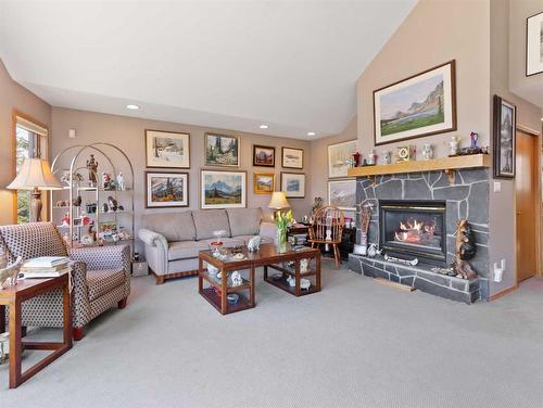 119 Benchlands Terrace, Canmore, AB - Indoor Photo Showing Living Room With Fireplace