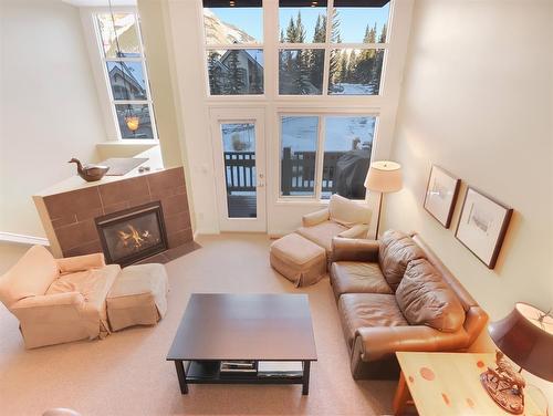 30 Antelope, Banff, AB - Indoor Photo Showing Living Room With Fireplace