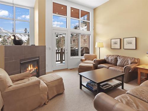 30 Antelope, Banff, AB - Indoor Photo Showing Living Room With Fireplace