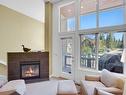 30 Antelope, Banff, AB  - Indoor Photo Showing Living Room With Fireplace 