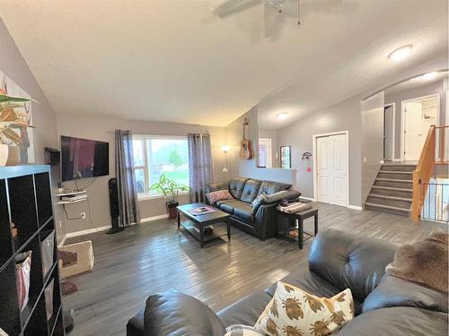 4513 Spruce Avenue, Boyle, AB - Indoor Photo Showing Living Room With Fireplace