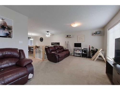 201A & 201B 7 Street Ne, Slave Lake, AB - Indoor Photo Showing Living Room With Fireplace