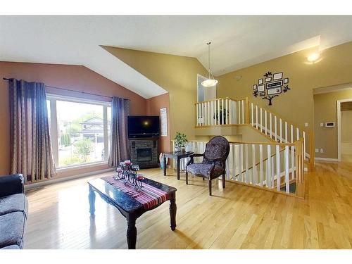 47 Springwood Drive Ne, Slave Lake, AB - Indoor Photo Showing Other Room With Fireplace