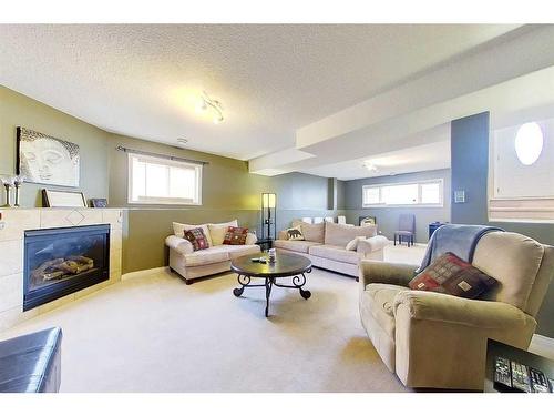 47 Springwood Drive Ne, Slave Lake, AB - Indoor Photo Showing Living Room With Fireplace