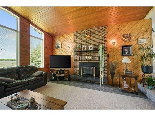 664059 Range Road 235, Rural Athabasca County, AB - Indoor Photo Showing Living Room With Fireplace