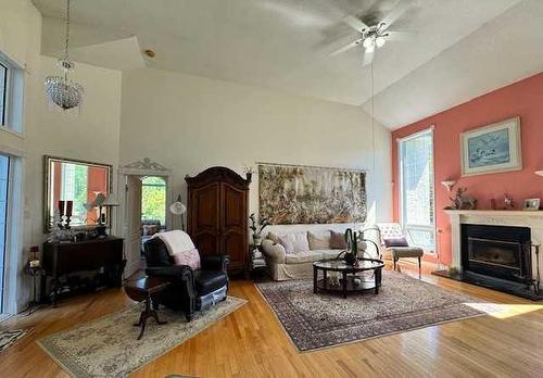 50 Lakeview Heights, Canyon Creek, AB - Indoor Photo Showing Living Room With Fireplace