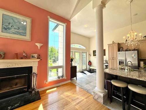 50 Lakeview Heights, Canyon Creek, AB - Indoor Photo Showing Living Room With Fireplace