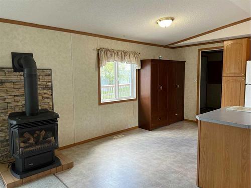 907 6 Avenue, Fox Creek, AB - Indoor With Fireplace