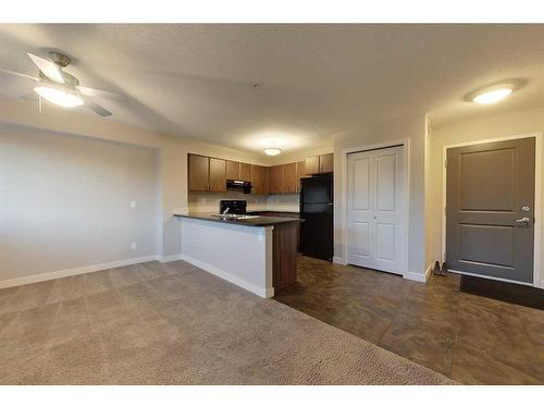 106-709 6 Avenue Se, Slave Lake, AB - Indoor Photo Showing Kitchen