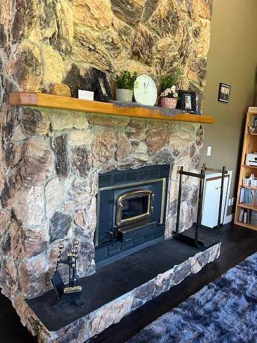 114012 Township Road 592B, Rural Woodlands County, AB - Indoor Photo Showing Living Room With Fireplace