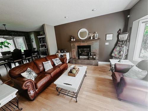 42 Ravine Drive, Whitecourt, AB - Indoor Photo Showing Living Room With Fireplace