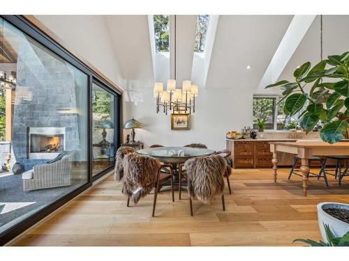 902 16Th Street, Canmore, AB - Indoor Photo Showing Dining Room With Fireplace