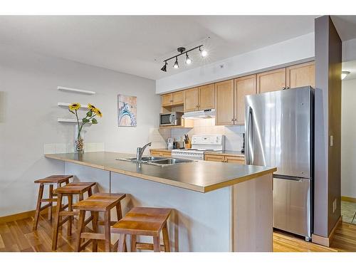 307-743 Railway Avenue, Canmore, AB - Indoor Photo Showing Kitchen With Double Sink