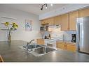 307-743 Railway Avenue, Canmore, AB  - Indoor Photo Showing Kitchen With Double Sink 