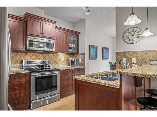 511-80 Dyrgas Gate, Canmore, AB - Indoor Photo Showing Kitchen With Double Sink