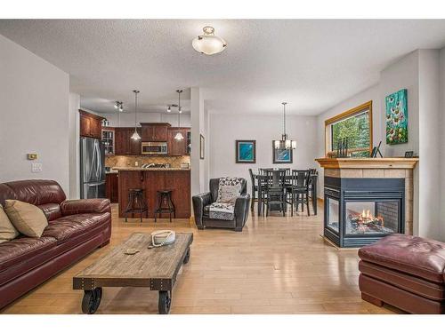 511-80 Dyrgas Gate, Canmore, AB - Indoor Photo Showing Living Room With Fireplace