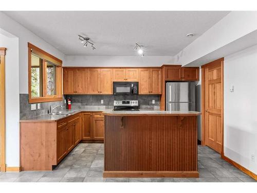 227 Miskow Close, Canmore, AB - Indoor Photo Showing Kitchen With Double Sink